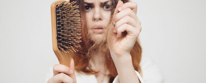 Why is my hair falling out? - a woman wondering about causes of hair loss in women